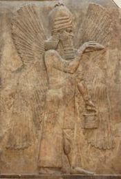 Ancient Assyrian stone relief of a genie